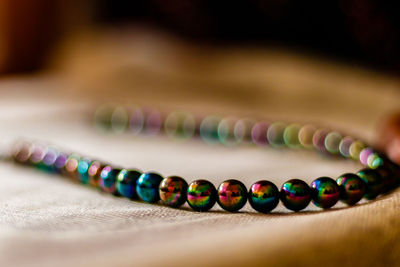 Close-up of multi colored jewelry on table