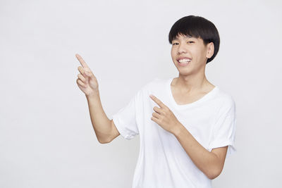 Portrait of smiling mid adult man against white background
