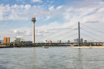 Rhine tower in the harbor called medienhafen at the river rhine in düsseldorf, germany