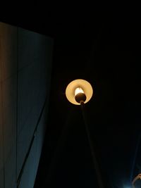 Low angle view of illuminated light bulb