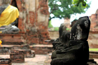 Statue of buddha against building