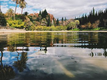 Scenic view of lake against cloudy sky