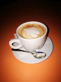 Close-up of cappuccino on table