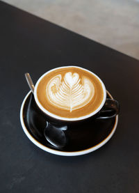 Close-up of cappuccino on table