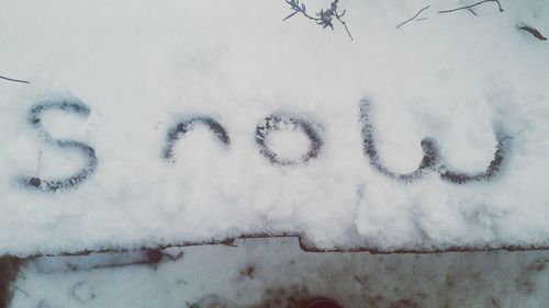 High angle view of snowflakes on snow