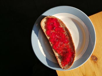 High angle view of strawberries in plate on table
