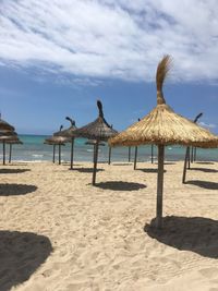 Gazebo on beach against sky