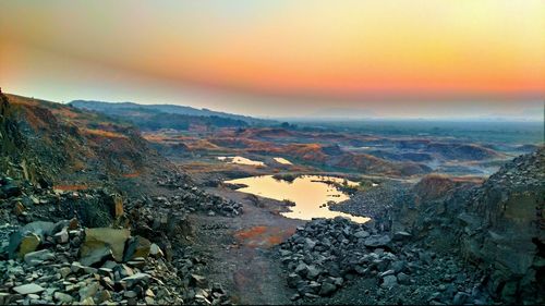 Aerial view of landscape against sky during sunset