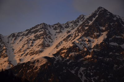 Scenic view of snowcapped mountains against clear sky