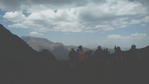 Scenic view of mountains against cloudy sky