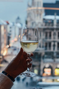 Close-up of hand holding wine glass