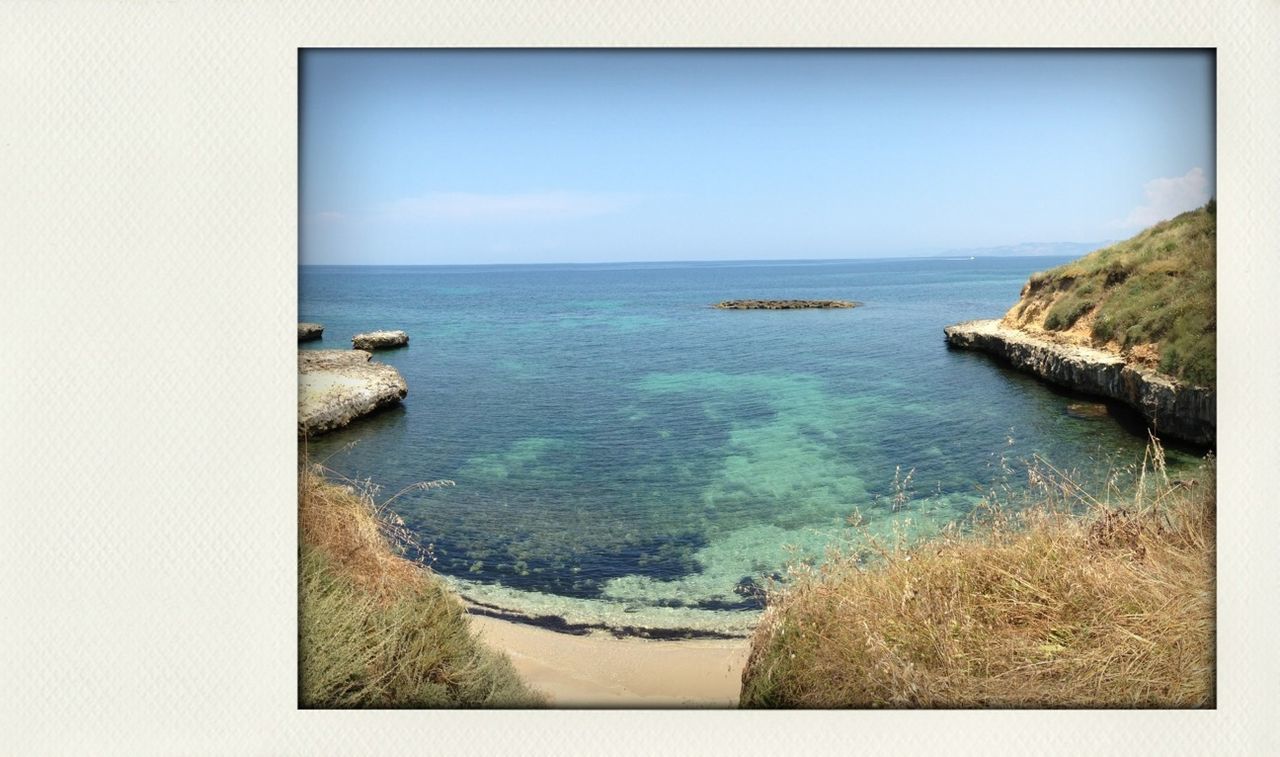 sea, horizon over water, water, scenics, tranquil scene, tranquility, clear sky, beauty in nature, nature, copy space, seascape, idyllic, blue, beach, coastline, shore, sky, ocean, rock formation, rock - object