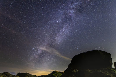 Scenic view of star field against sky at night