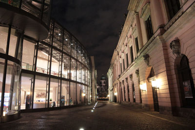 Illuminated city street at night