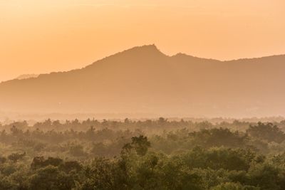 Scenic view of mountains against sky during sunset