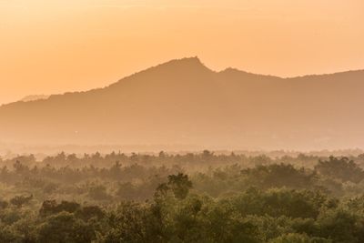 Scenic view of mountains against sky during sunset