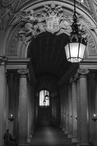 Illuminated lamps hanging in corridor