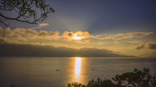 Scenic view of sea against sky at sunset