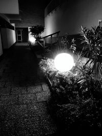 Close-up of illuminated building against sky at night