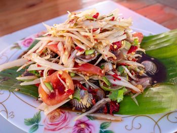 High angle view of chopped fruits in plate on table