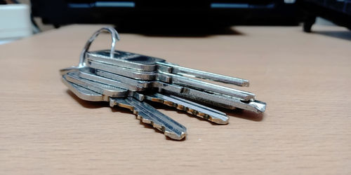 Close up keys on wooden table in the office.