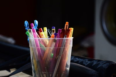 Close-up of multi colored pencils in container