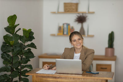 Woman working at home with laptop. home office.  notebook for working. 