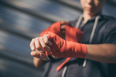 Midsection of boy wearing boxing strap