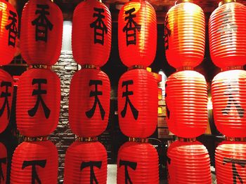 Full frame shot of illuminated lanterns hanging in row