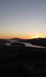 Scenic view of silhouette landscape against clear sky during sunset