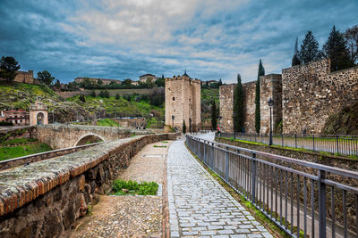 View of old building against cloudy sky