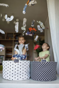 Kids playing with laundry at home