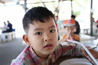 Portrait of cute boy looking away