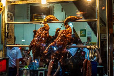 Duck meat hanging in shop