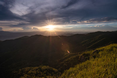 Scenic view of mountains against sky during sunset