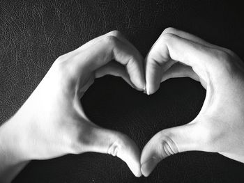 Close-up of hands holding heart shape