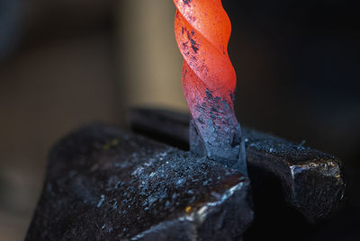 Close-up of hot metal on anvil in blacksmith workshop