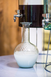 Close-up of decanter on table