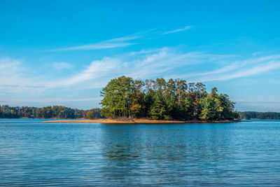 Scenic view of lake against blue sky