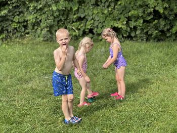 Full length of young woman exercising in park