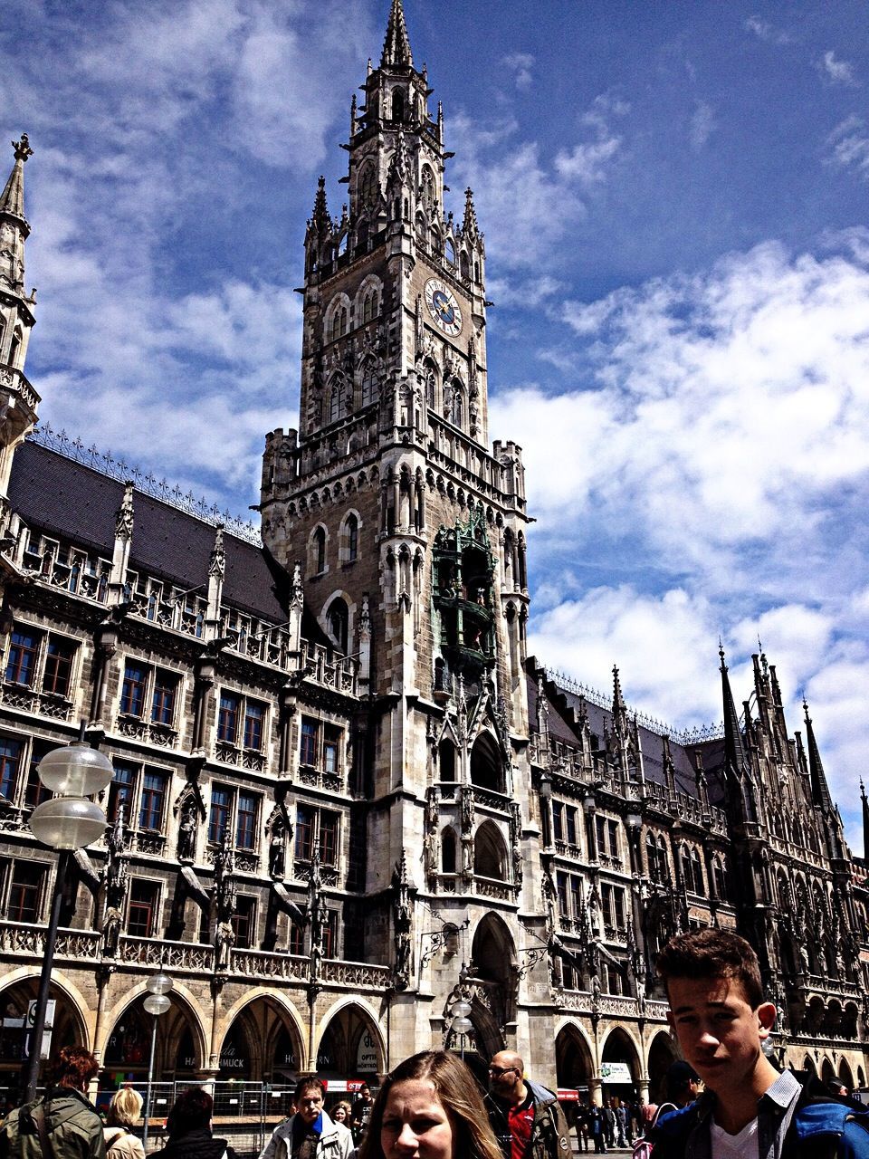 architecture, building exterior, built structure, sky, lifestyles, tourism, famous place, leisure activity, travel destinations, travel, low angle view, cloud - sky, person, large group of people, international landmark, men, religion, tourist