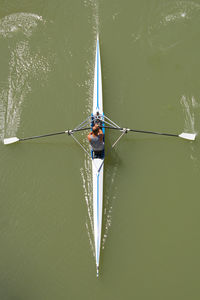 Directly above shot of man rowing boat in river