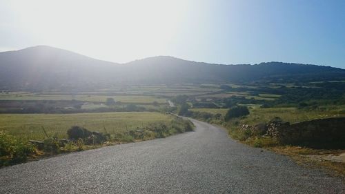 Road amidst landscape against clear sky