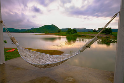 Hammock at lake against sky in the morning kaeng krachan
