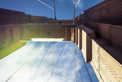 Low angle view of building against cloudy sky