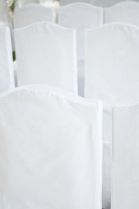 Close-up of white chairs