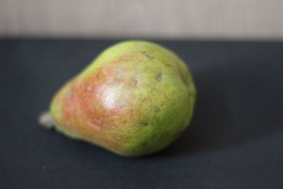 Close-up of apple against black background
