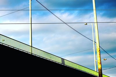 Low angle view of bridge against blue sky
