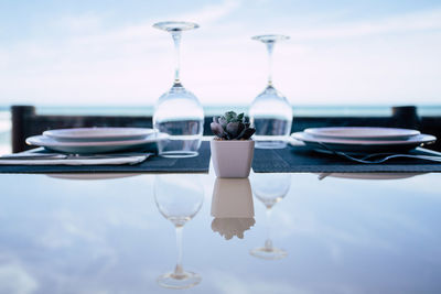 Close-up of drink on table at restaurant against sky