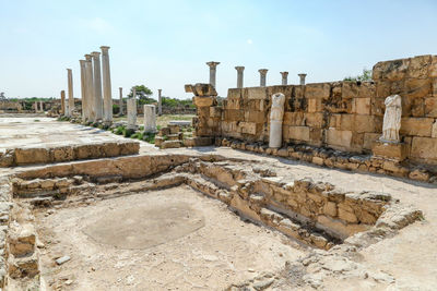 Famagusta, turkish republic of northern cyprus. columns and sculptures at ancient city salamis ruins